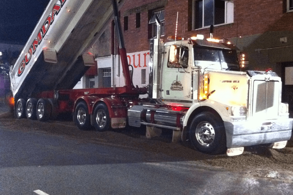 Photo of the 9 Buchanan 25 Donkin streetsWest End demolition project featuring a large dump truck | Featured image for Coles, Rochedale.