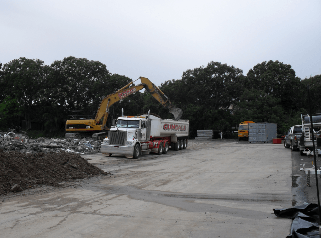 Loading waste into back of a truck | Featured image for Commercial Demolition Brisbane page Gumdale Demolitions