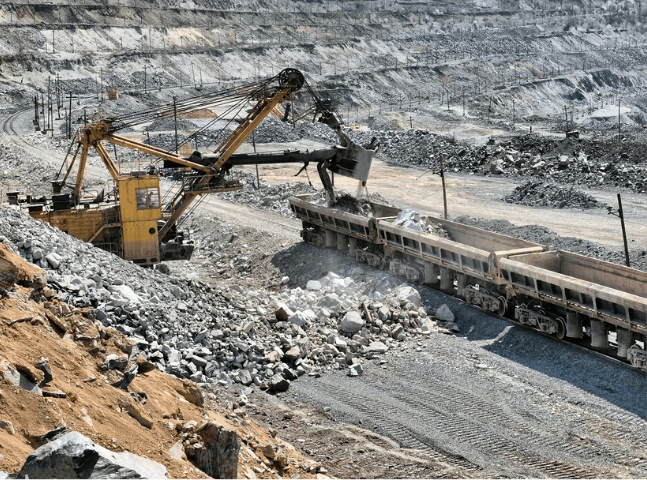 Loading ore onto train cars | Featured image for Industrial Demolition Brisbane page Gumdale Demolitions