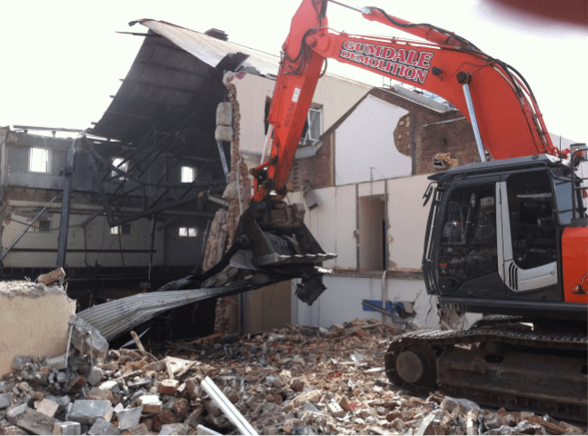 Photo of warehouses being demolished | Featured image for Industrial Demolition.