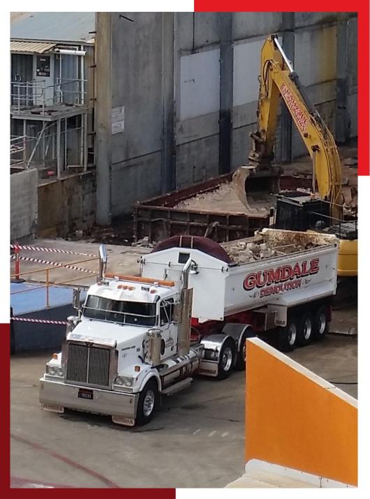 Loading waste into a truck | Featured image for Brisbane Demolition Companies Home Page Gumdale Demolitions