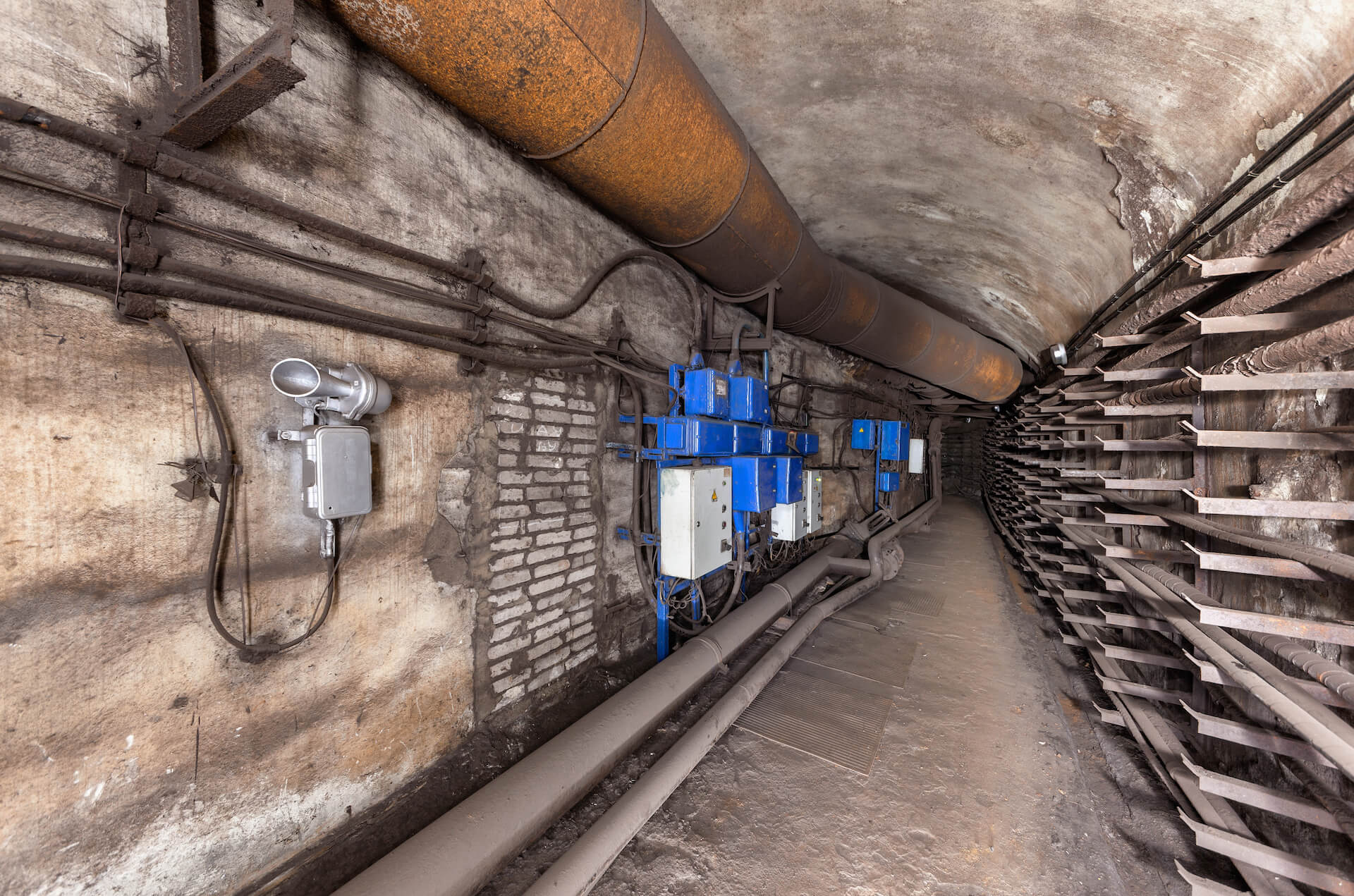 Underground tunnel with fuse boxes and pipes | Featured image for the Civil Demolition Contractors Page of Gumdale Demolition.