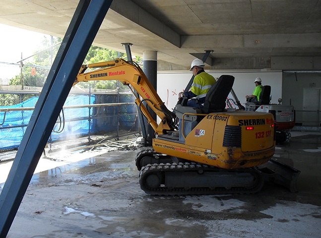 Men working in a concrete structure | Featured image for Residential Demolition Brisbane page Gumdale Demolitions